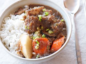 Galbi jjim (braised short ribs) in a bowl along with rice.
