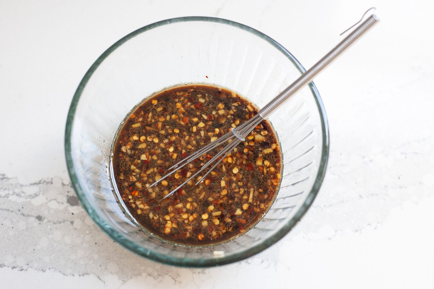 Bowl of Soy Sauce, Ginger, Garlic, and Red Pepper Flakes for Zucchini Stir-Fry Recipe