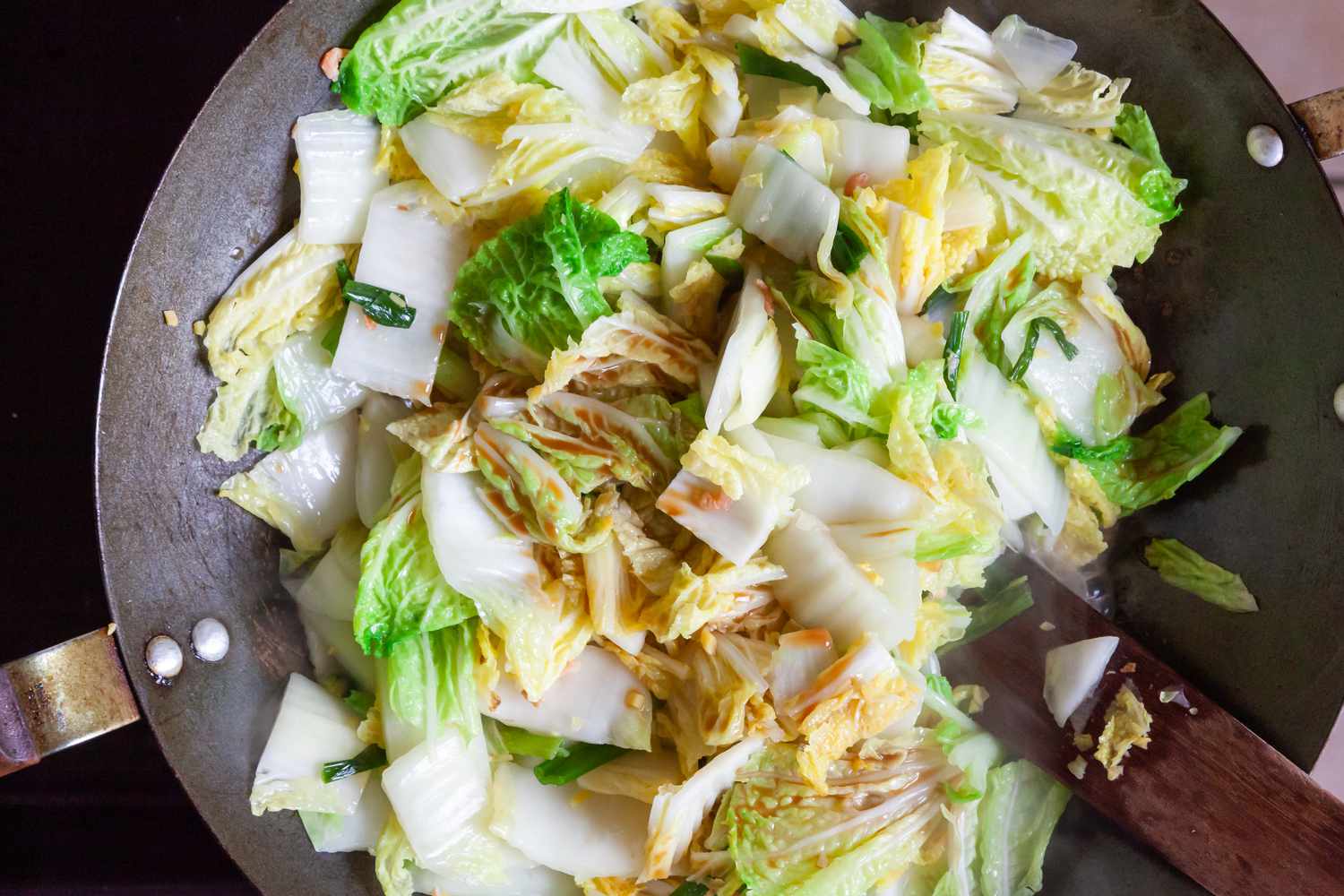Napa Cabbage with Dried Shrimp being cooked in a wok.