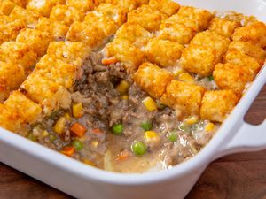Classic Tater Tot Hotdish in a baking dish with one scoop removed