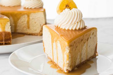 Easy Banoffee Cheesecake Pie - slice of pie with mound of whipped cream and banana slice