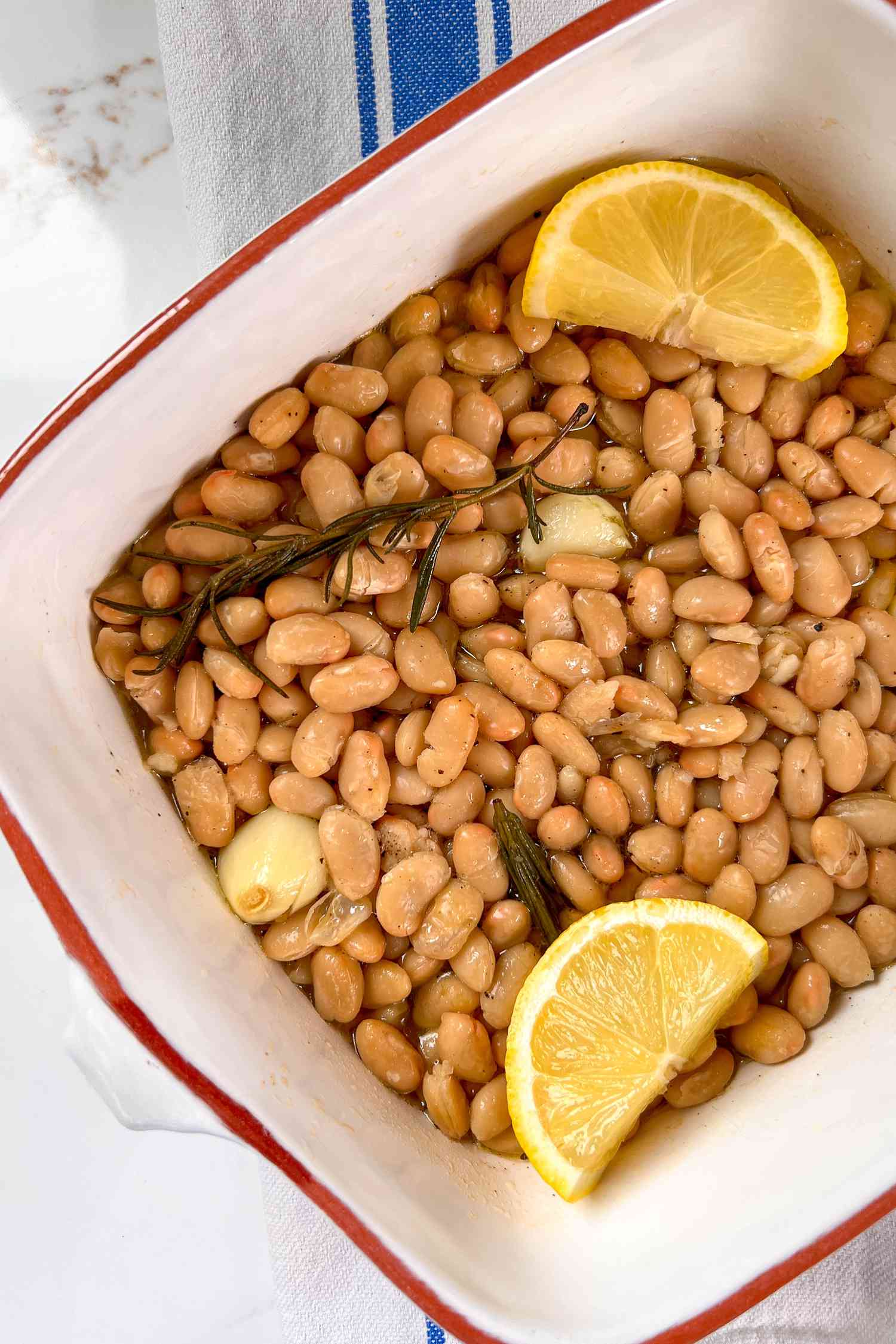Braised white beans in a casserole dish