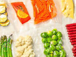 Vacuum sealed produce, salmon, cheese, and sausages