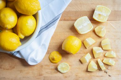 Chopped lemons on a cutting board.