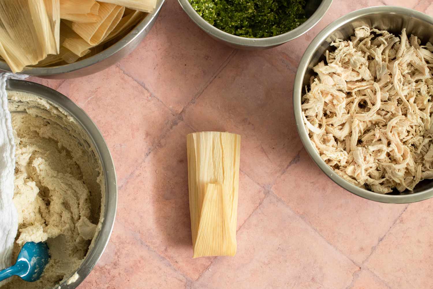 Making the Tamales: Narrow End of Corn Husk Folded Vertically onto the Tamale