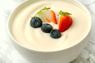 yogurt in a bowl, garnished with fruit