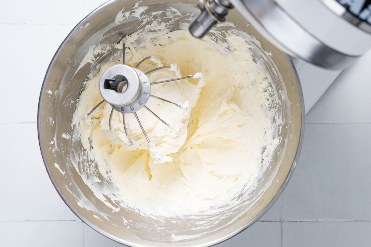 Whipped cream cheese mixed into the whipped cream in the mixer bowl (still attached to the stand mixer) for Cookie crumb, butter, and sugar blended together in a food processor for no-bake pumpkin cheesecake recipe