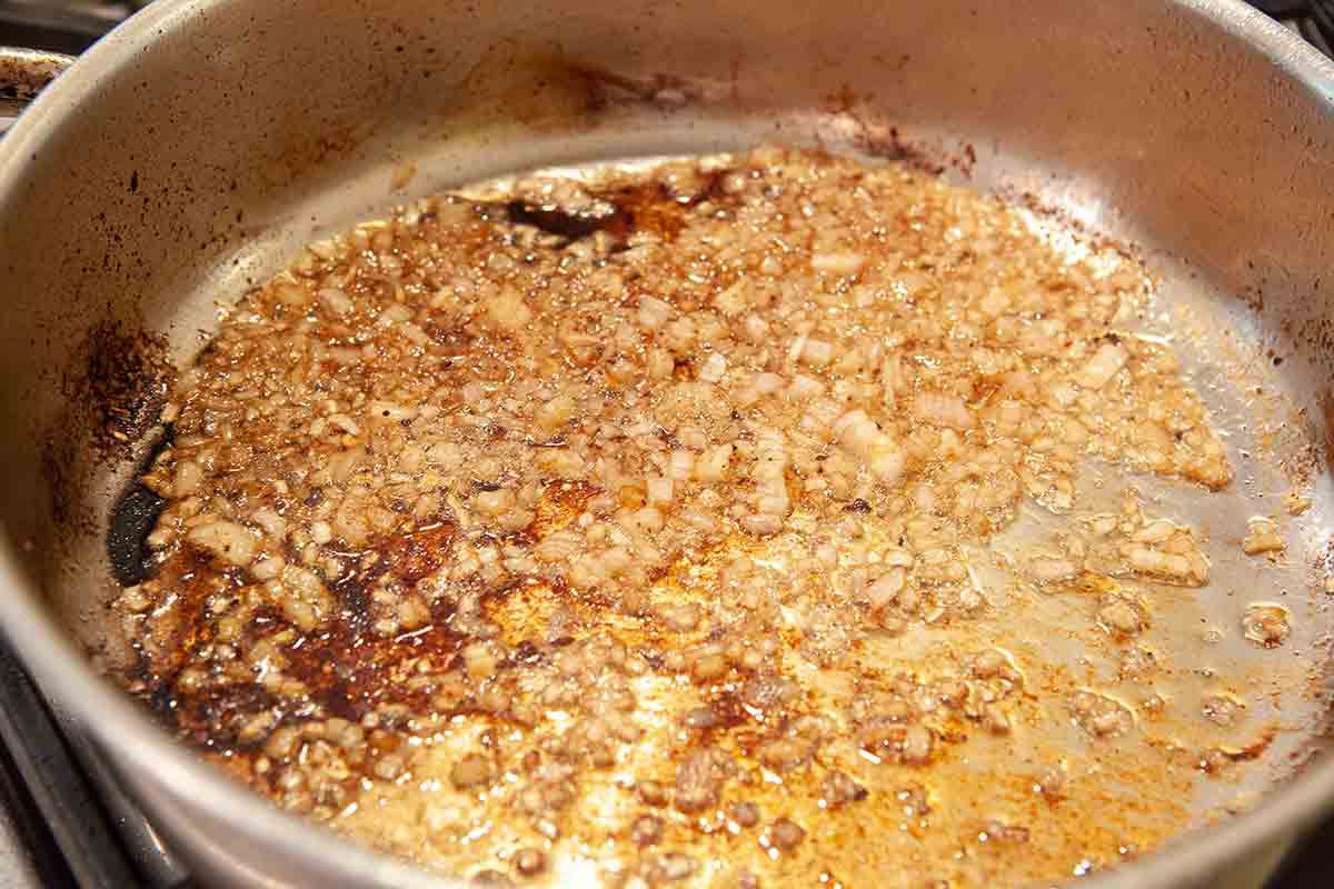 shallots cooking for peppercorn steak sauce