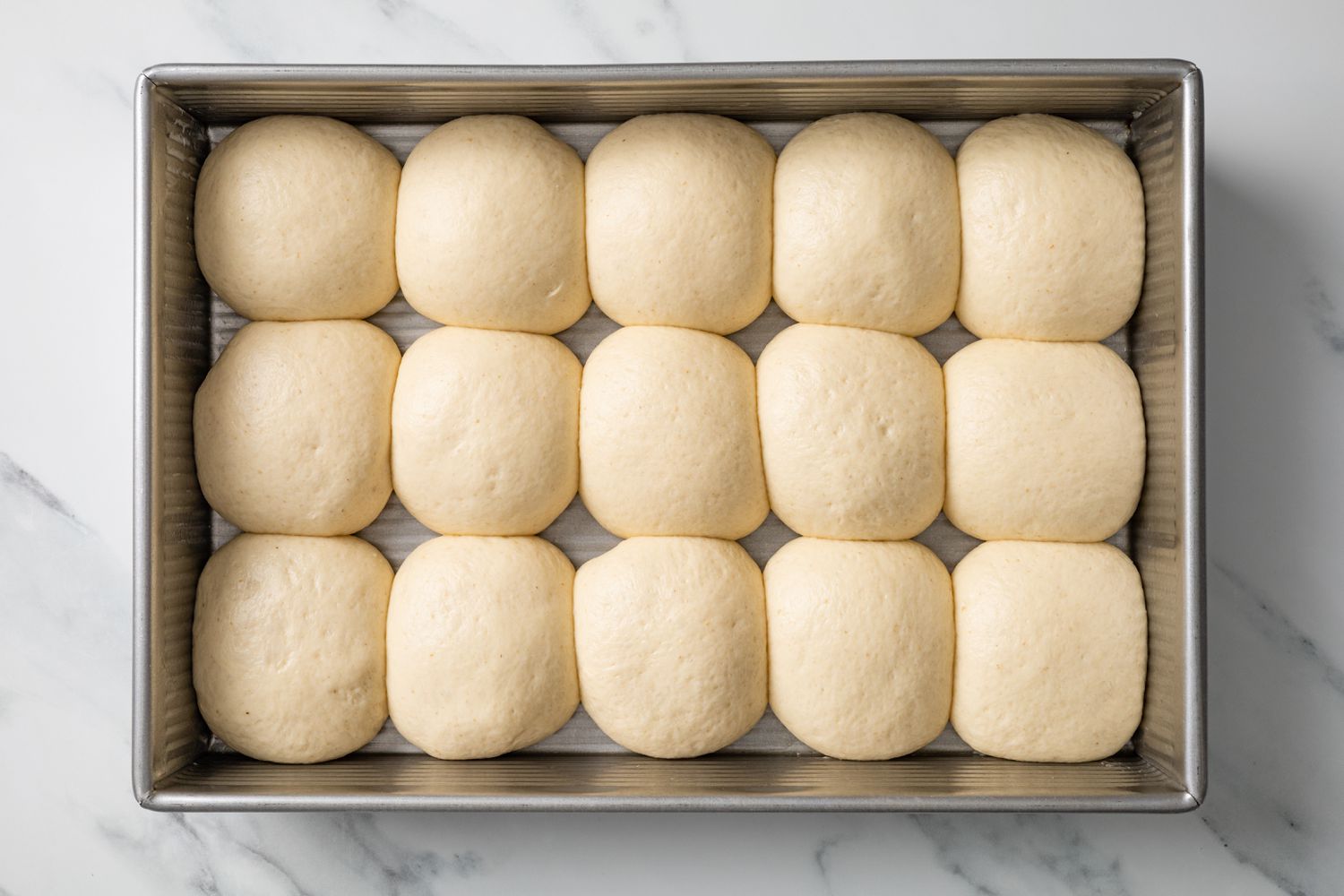 Dough Balls in Baking Pan after Second Proof