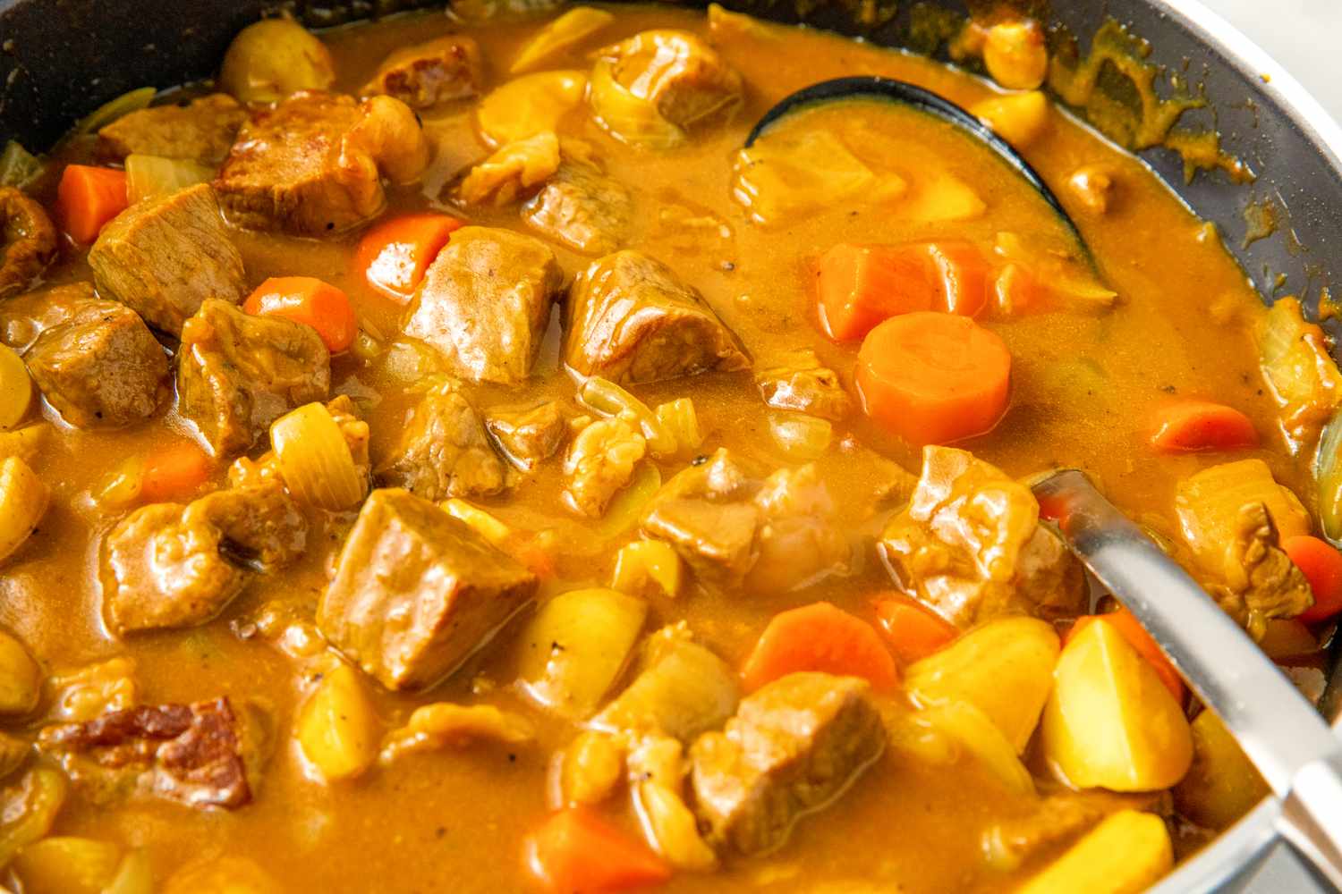 Japanese curry with meat and vegetables in a pan