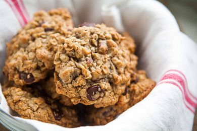 Best Oatmeal Chocolate Chip Cookies in a basket lined with a tea towel