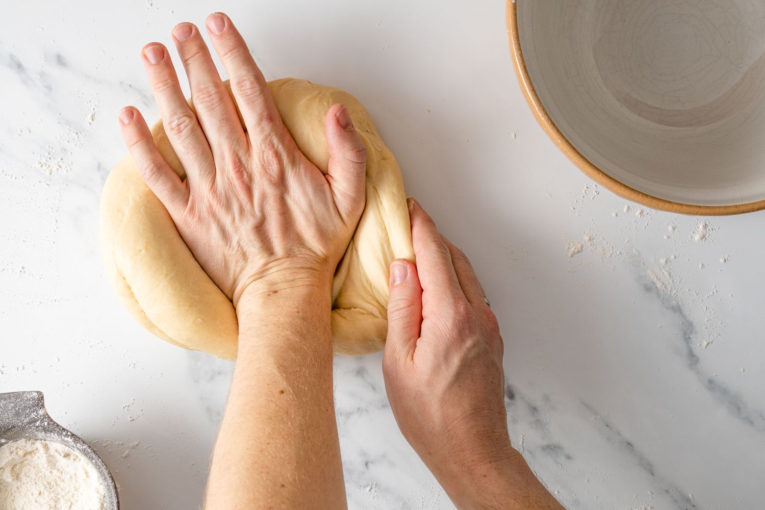 Knead dough on counter top