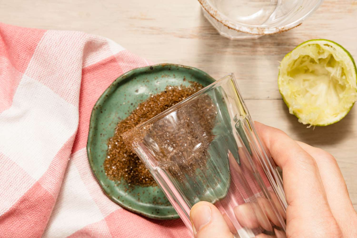 Glass Rim Dipped Into the Smoked Salt for Grilled Grapefruit Paloma Recipe