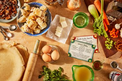 Thanksgiving meal prep scene with a pie in process and ingredients for making stuffing
