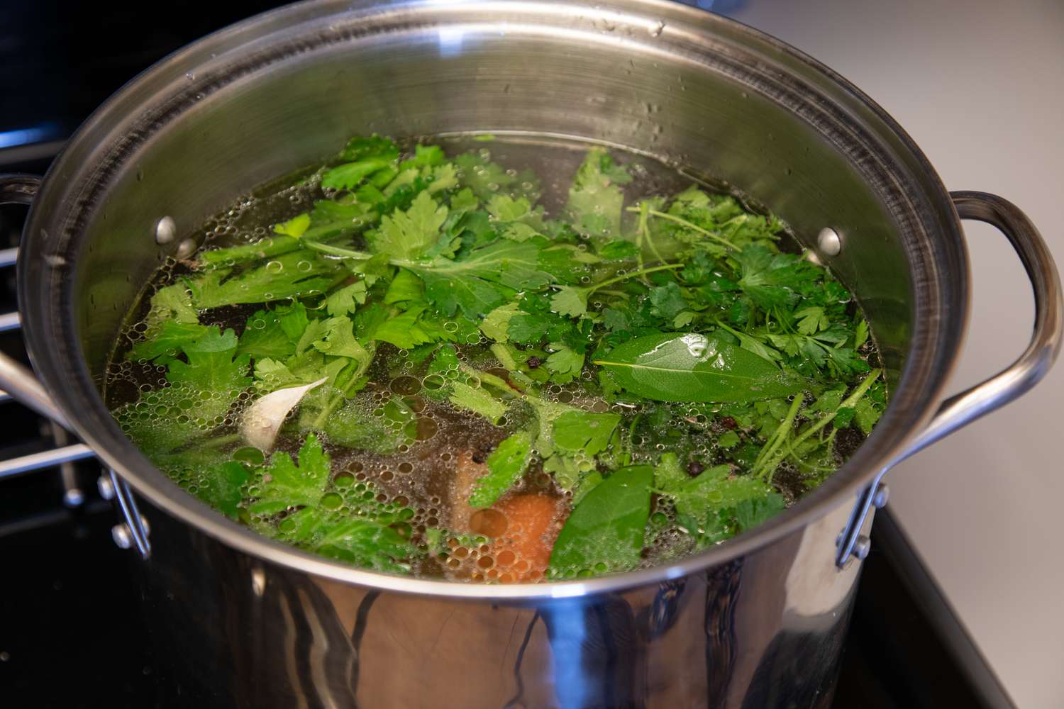 A large stock pot of vegetables to make a bone broth recipe