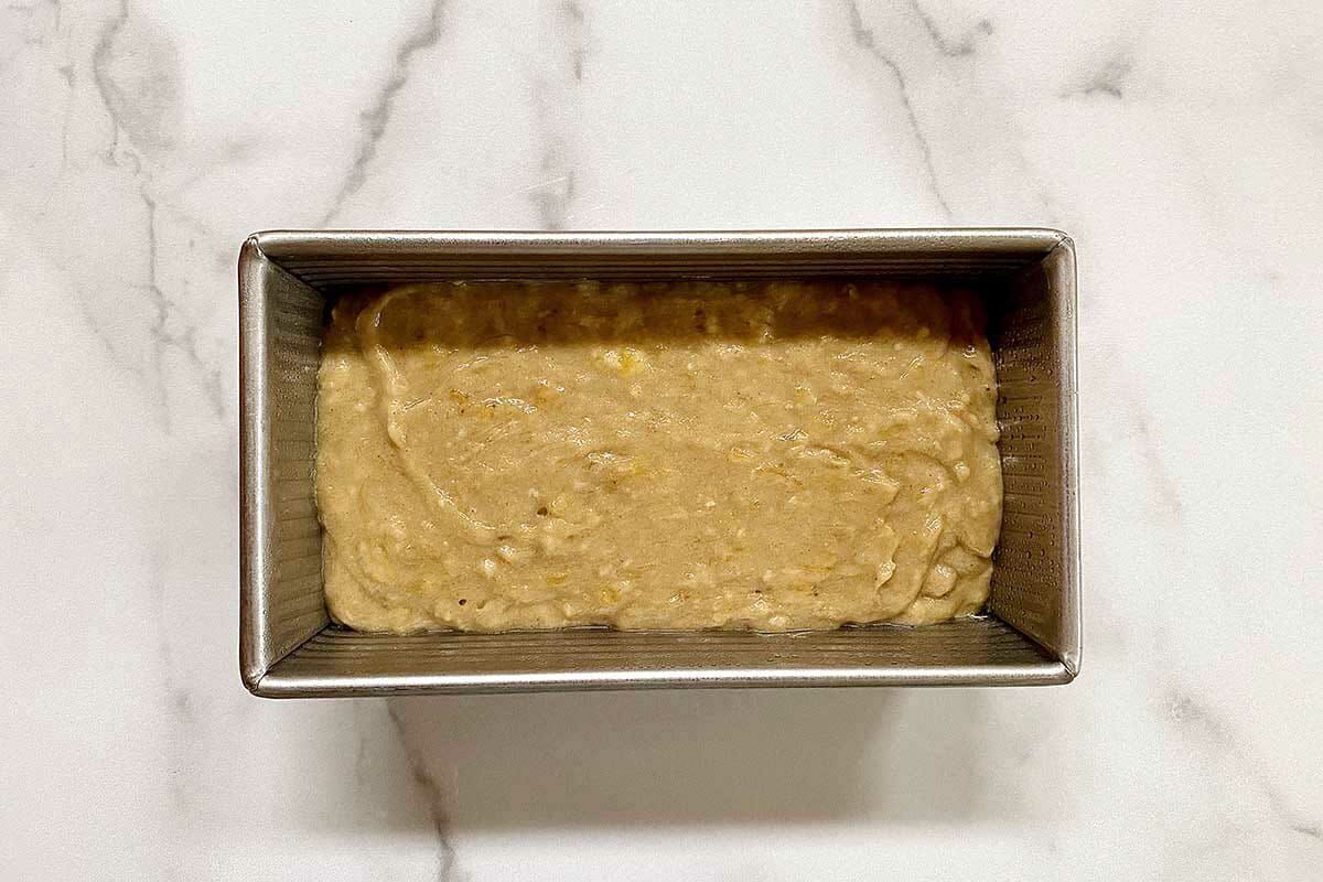 Simple Gluten-Free banana bread batter in a loaf pan.