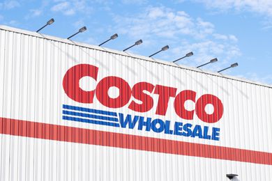 Image of the Costco logo on the metal siding of a Costco store