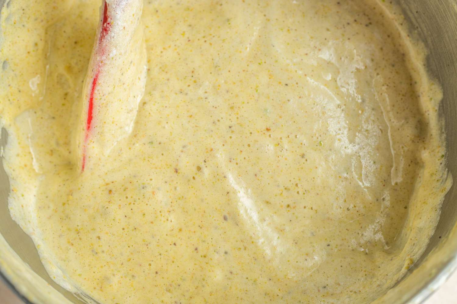 Egg Whites Folded into Pistachio Cardamom Tres Leches Cake Batter