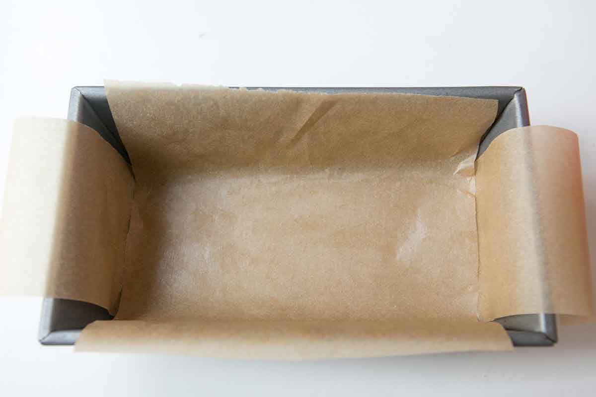 Line the fruit cake loaf pan with parchment