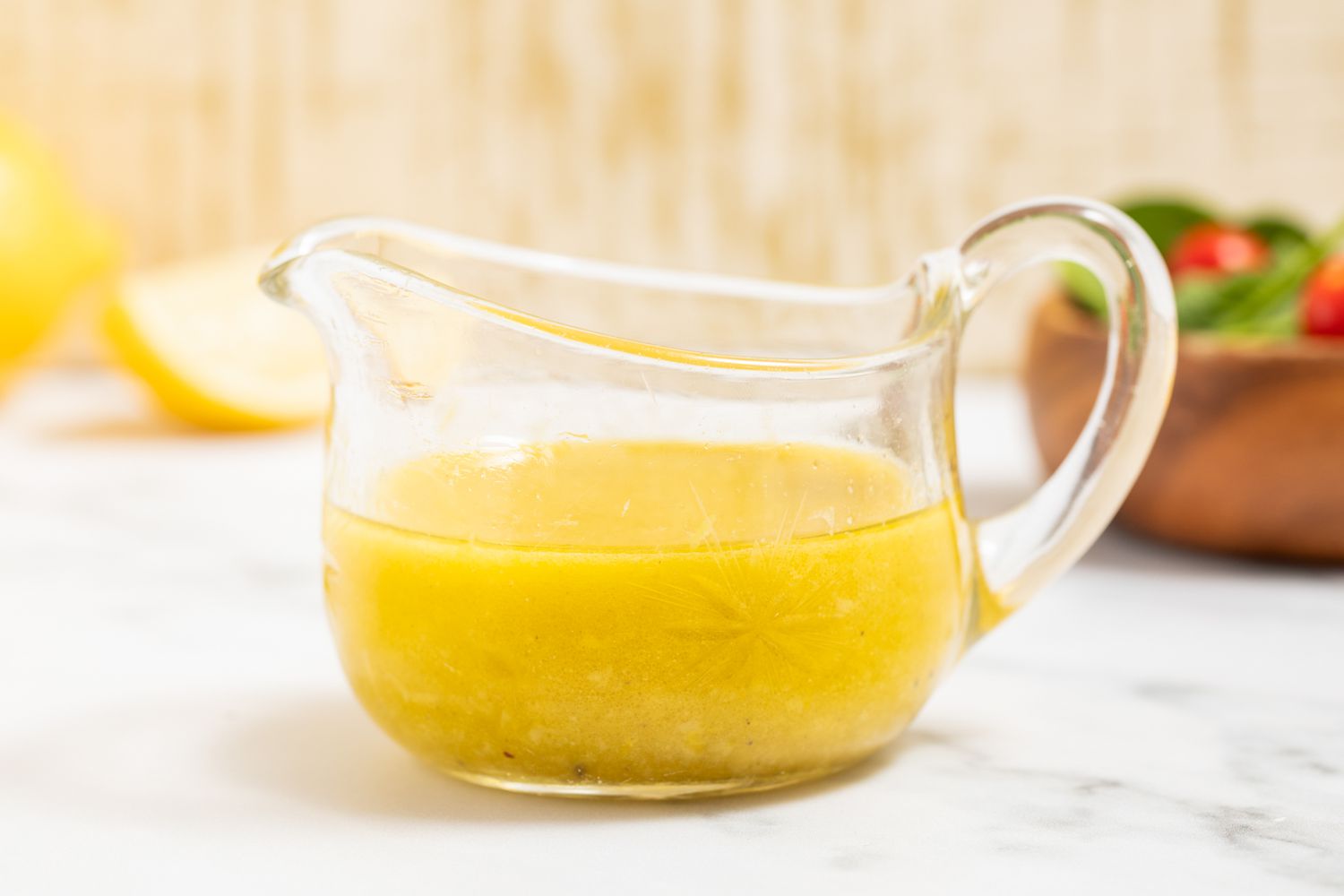 creamy lemon dressing in a gravy boat