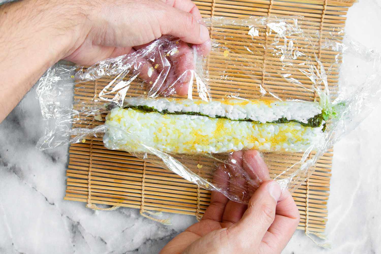 California Roll Removed from Plastic Wrap