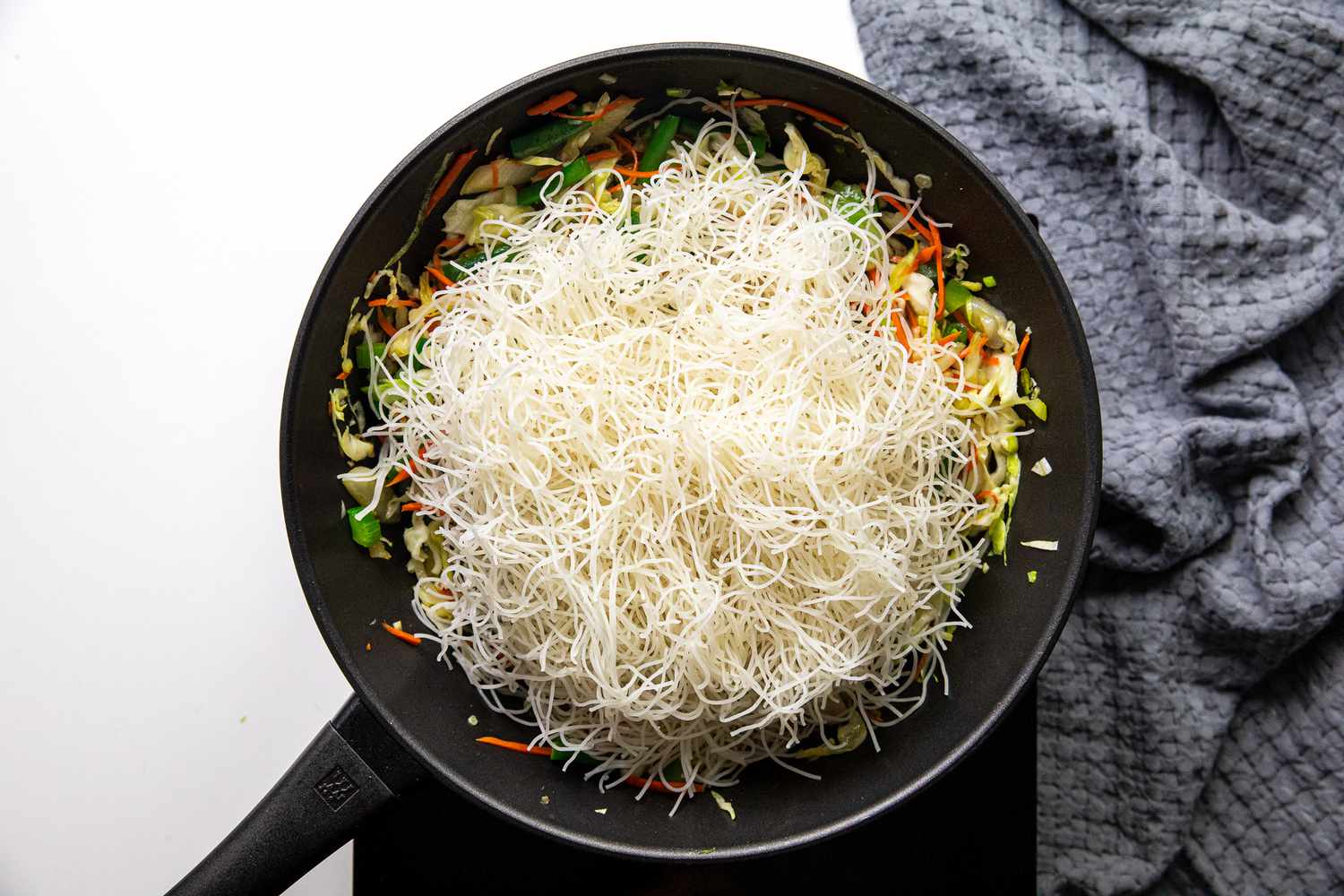 Bihon Noodles Added to Pancit Bihon in Wok
