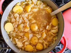 4-Ingredient Cabbage and Potato Soup in a large pot with a ladel