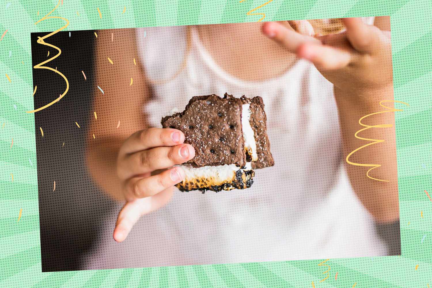 Person holding a chocolate s'more