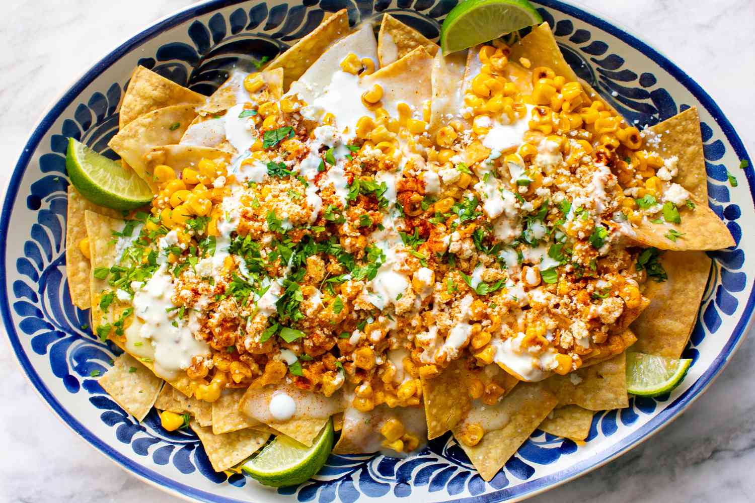 A platter of Mexican street corn nachos (elote)