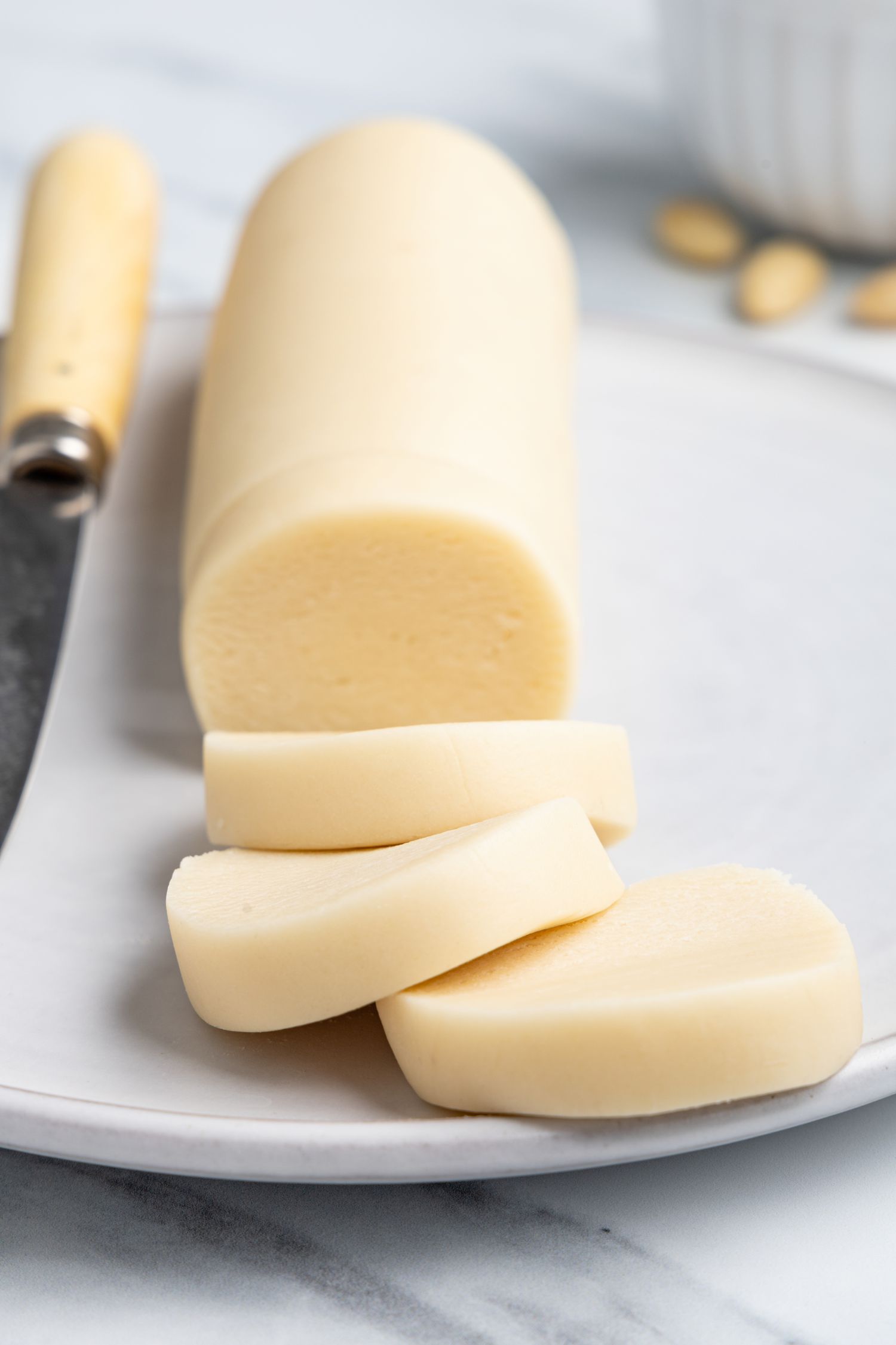 Log of Marzipan with Sliced Marzipan Disks Next to It
