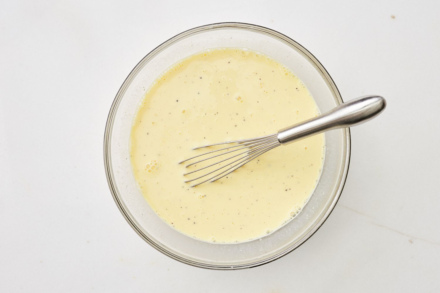 Wet ingredients whisked together for monte cristo croissant casserole recipe