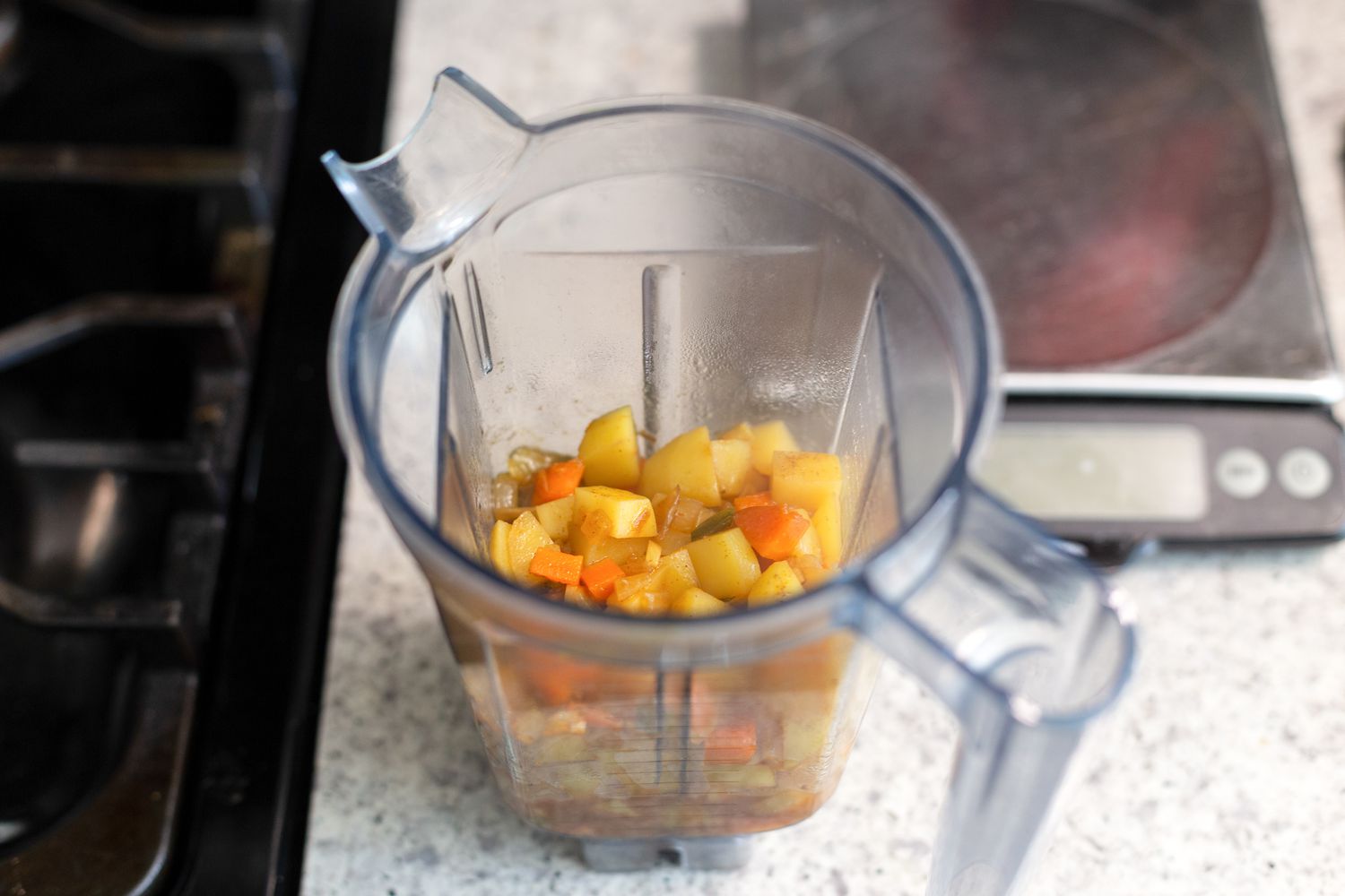 Add veggies to blender and blend for vegan queso