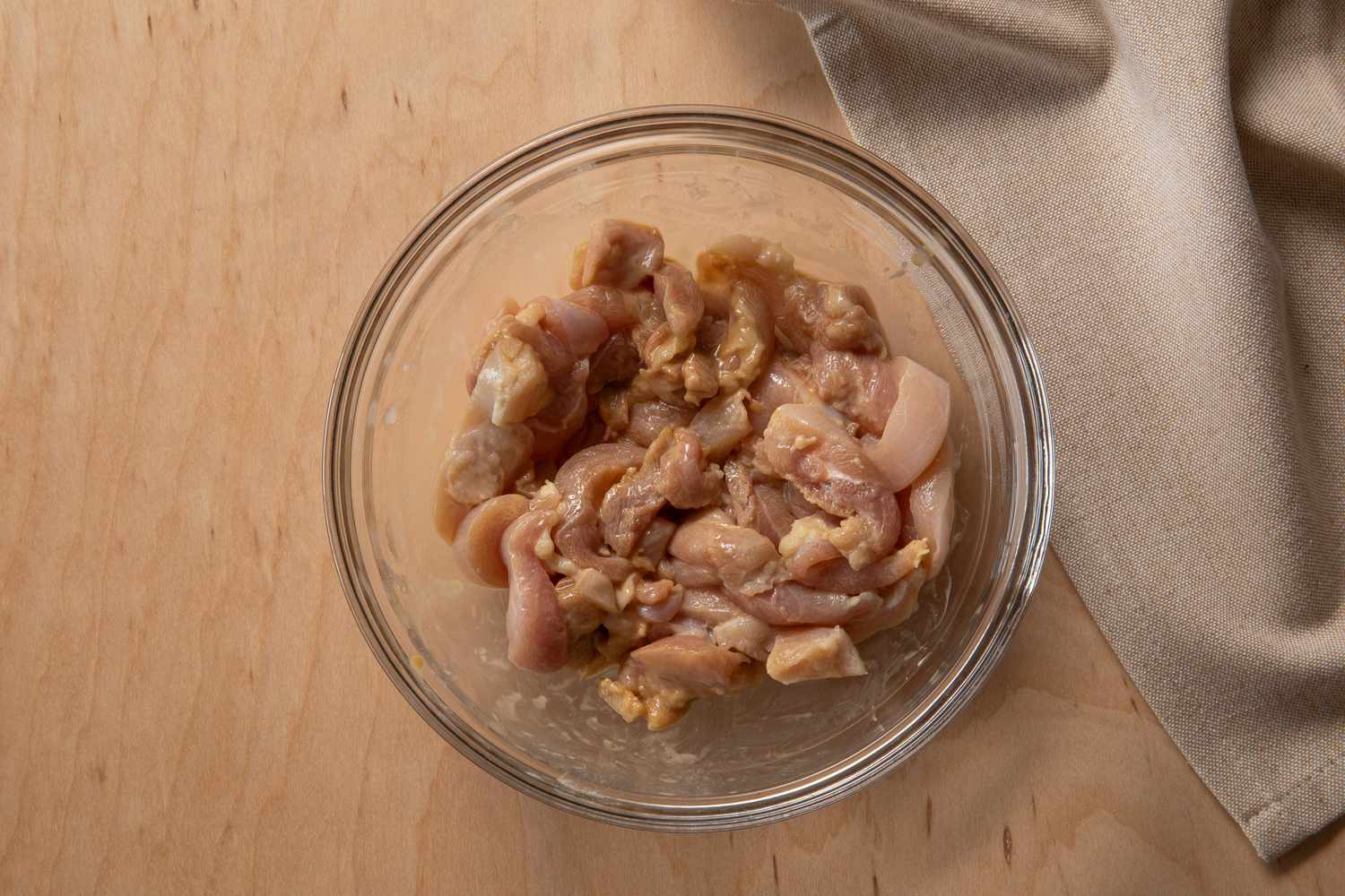 bowl of marinated chicken for pad see ew recipe