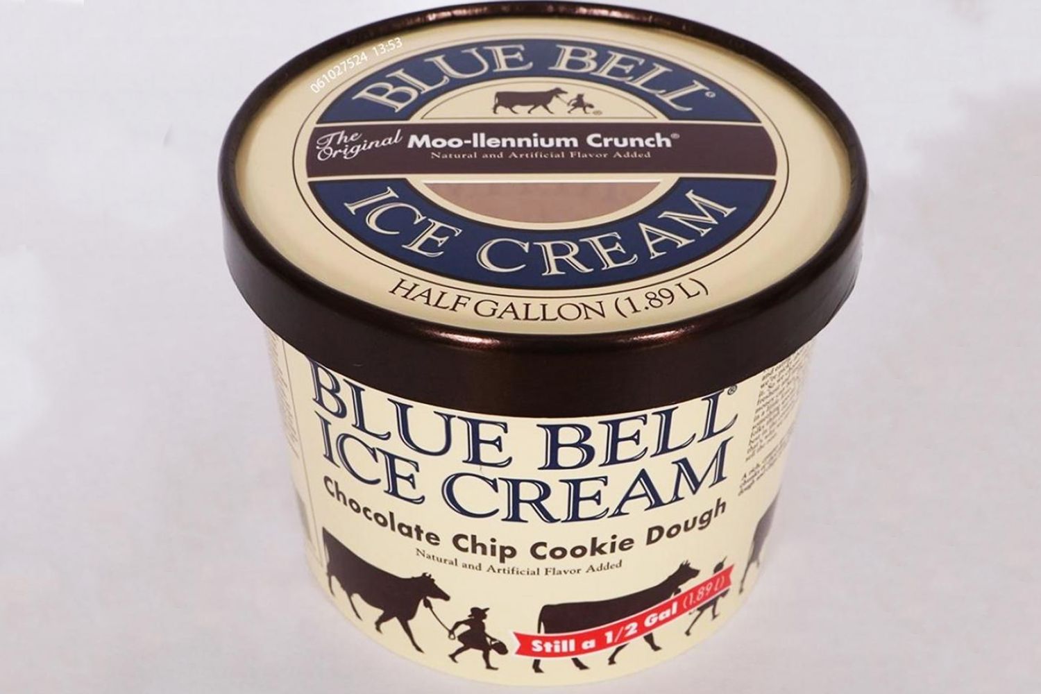 A container of Blue Bell Chocolate Chip Cookie Dough ice cream halfgallon size on a plain background