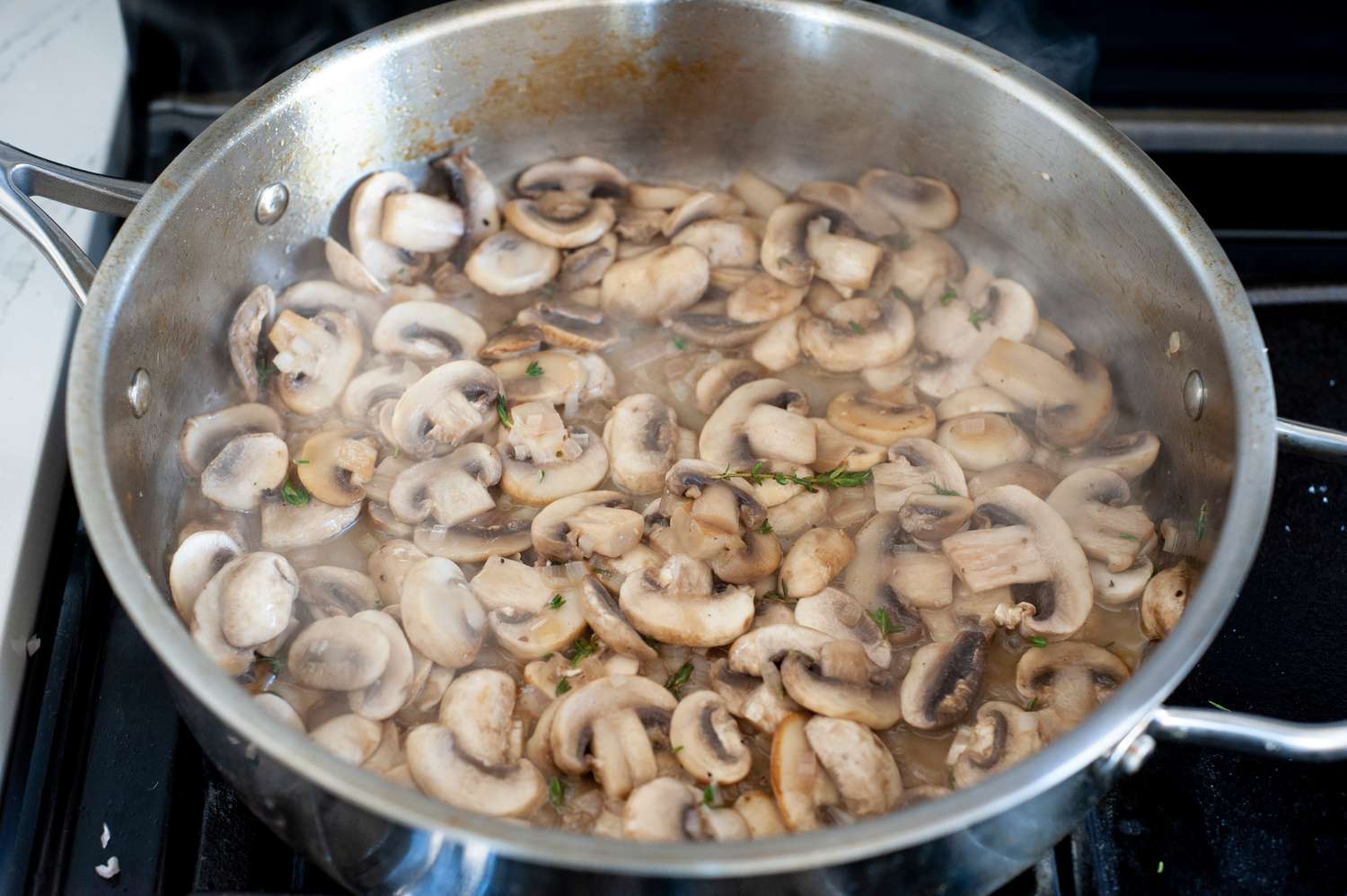 Cook mushrooms in skillet until tender.