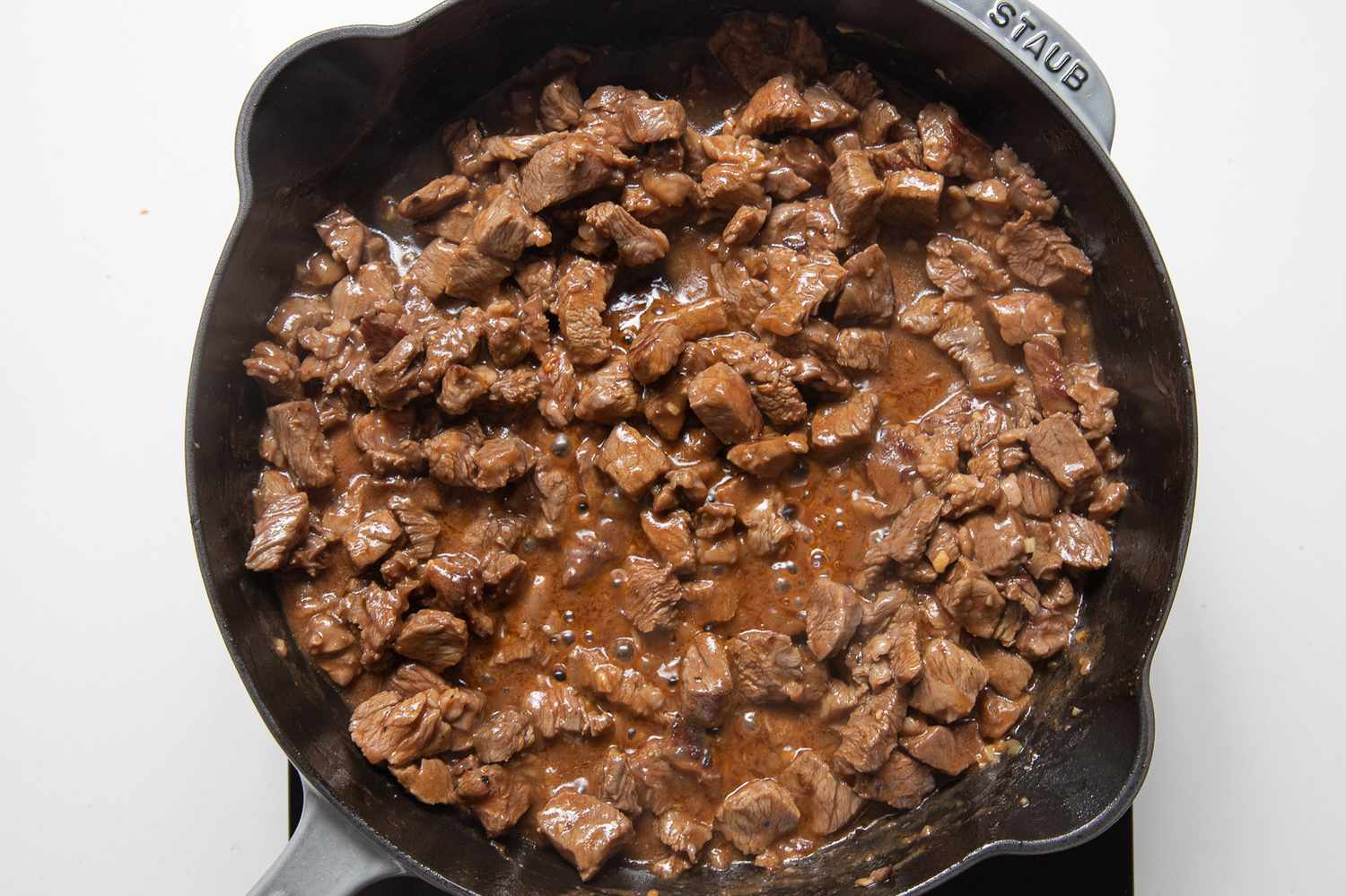 Lok Lak (Shaking Beef) Recipe Cooking in a Cast Iron Skillet