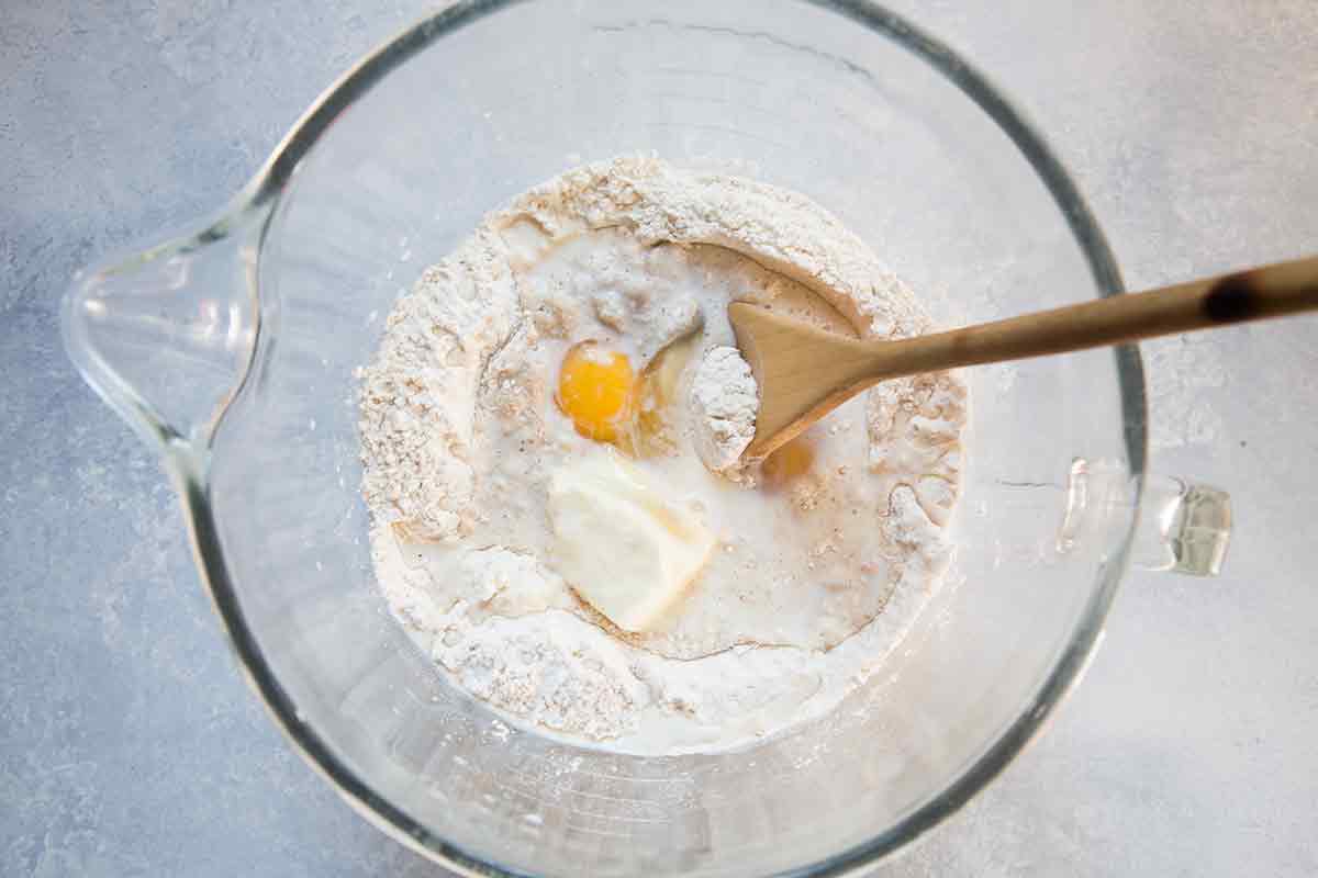 Add an egg to the dry ingredients for hot cross buns