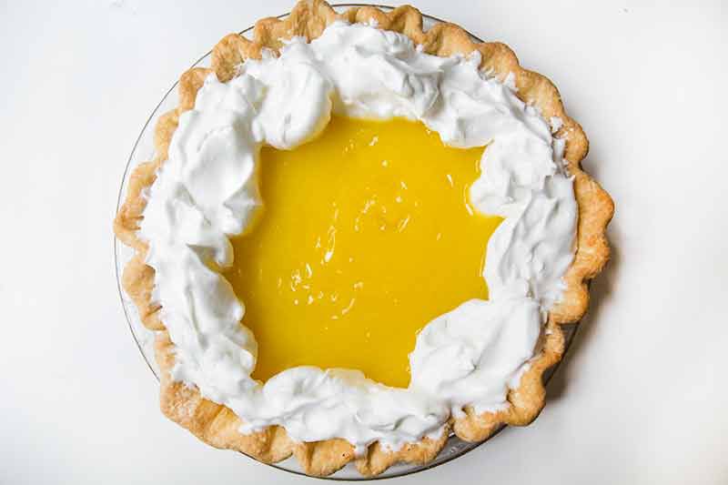 Adding meringue to top of lemon curd filling for lemon meringue pie