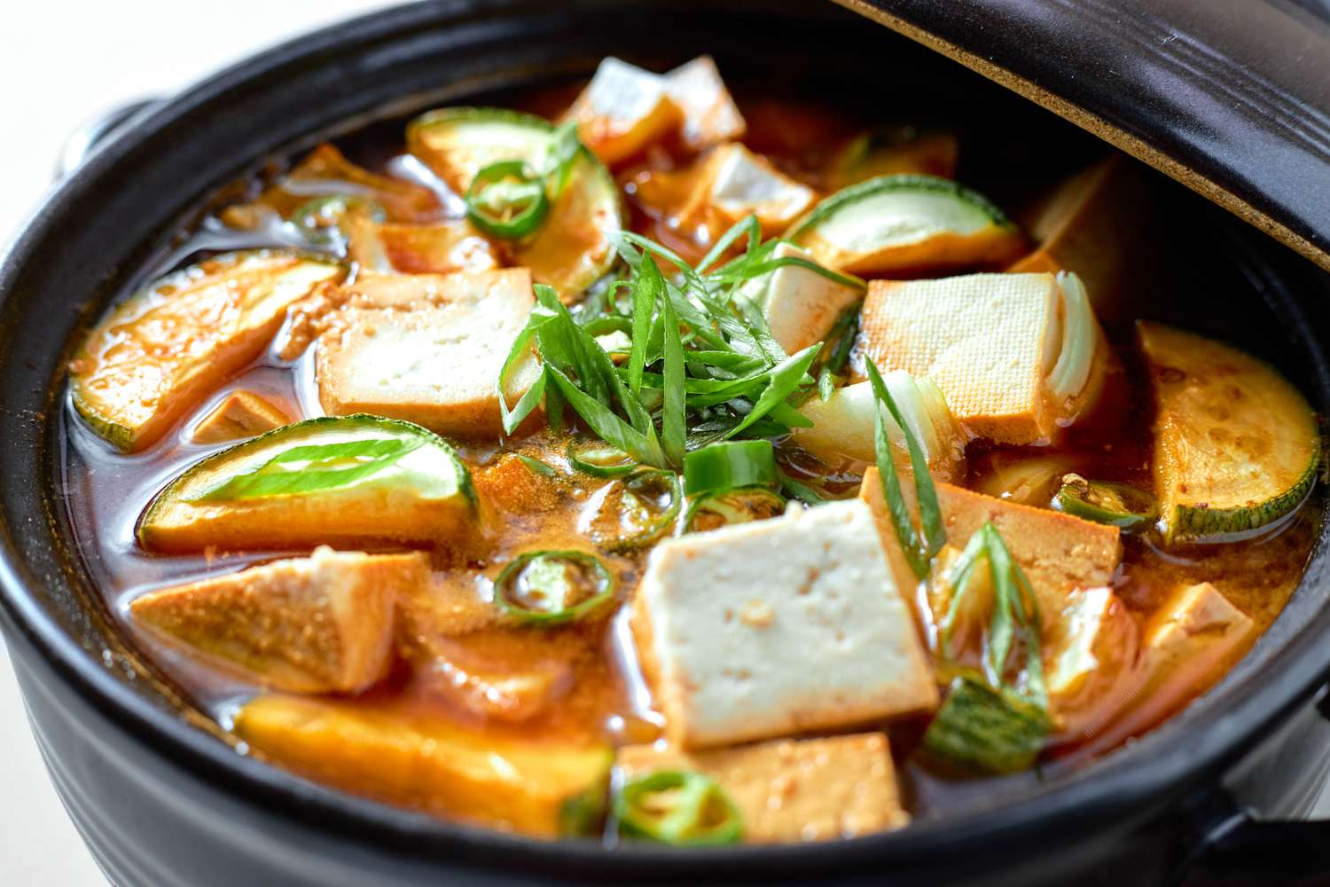 Close-up of Doenjang Jjigae Topped With Sliced Scallions 