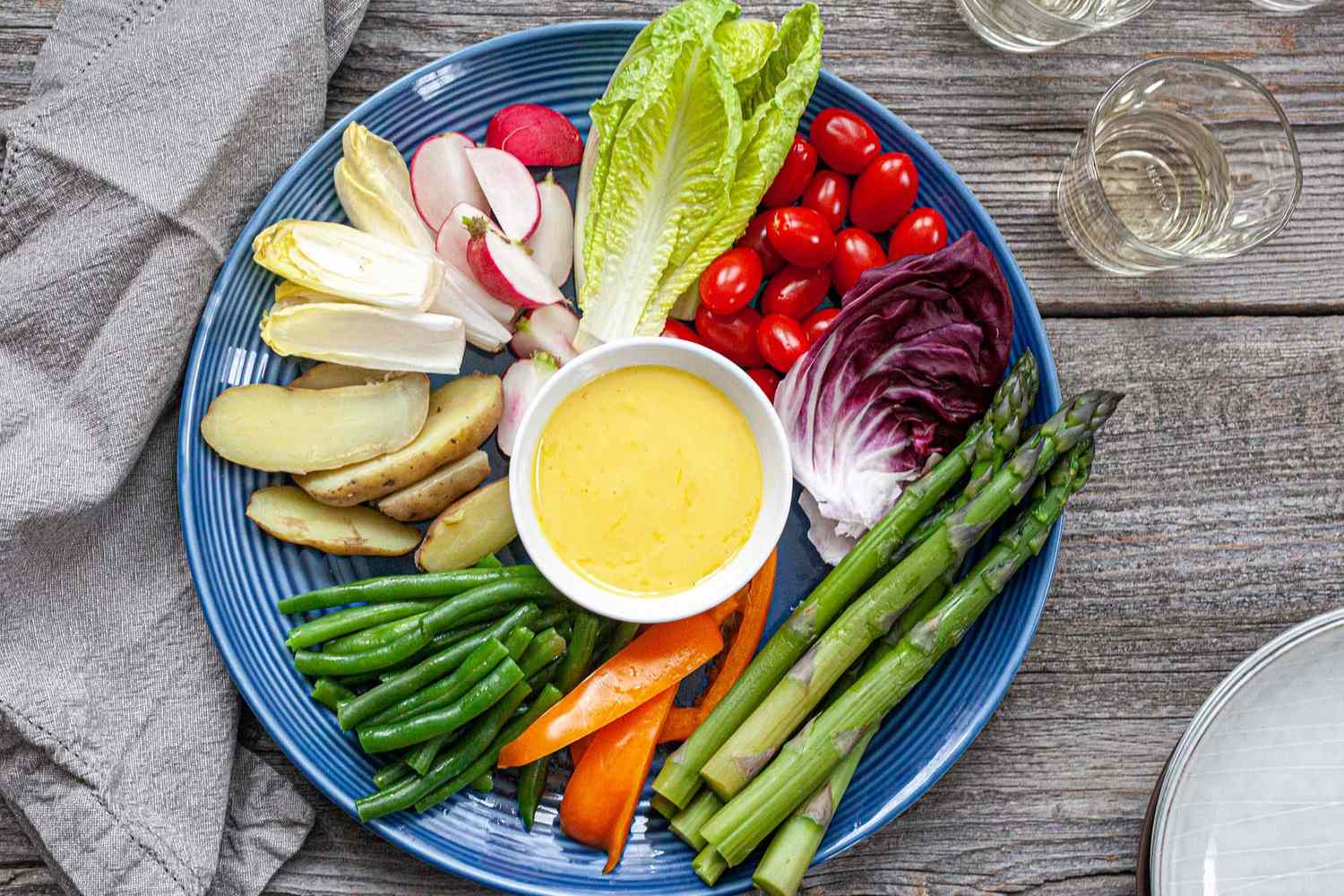 A plate of crudite with aioli, ready to serve and eat