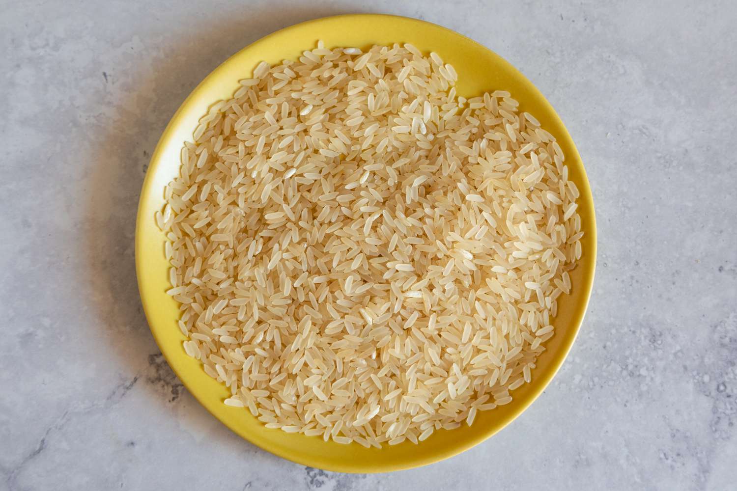 Parboiled rice on a yellow plate