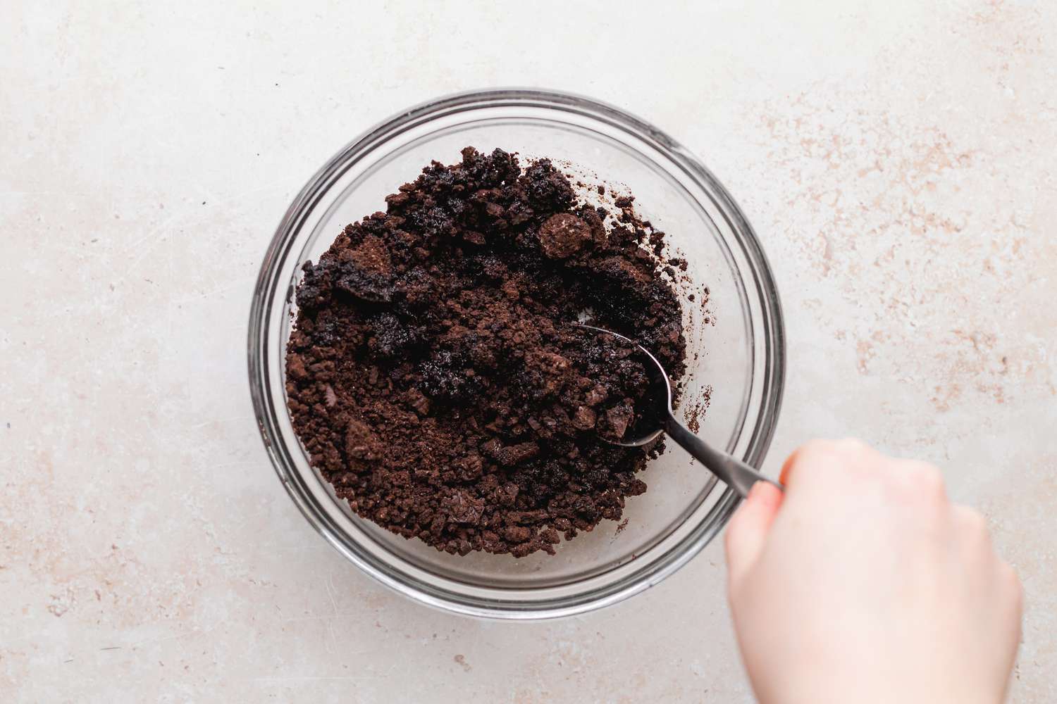 Cookie Layer Mixed in a Bowl with a Spoon for Ice Cream Cake