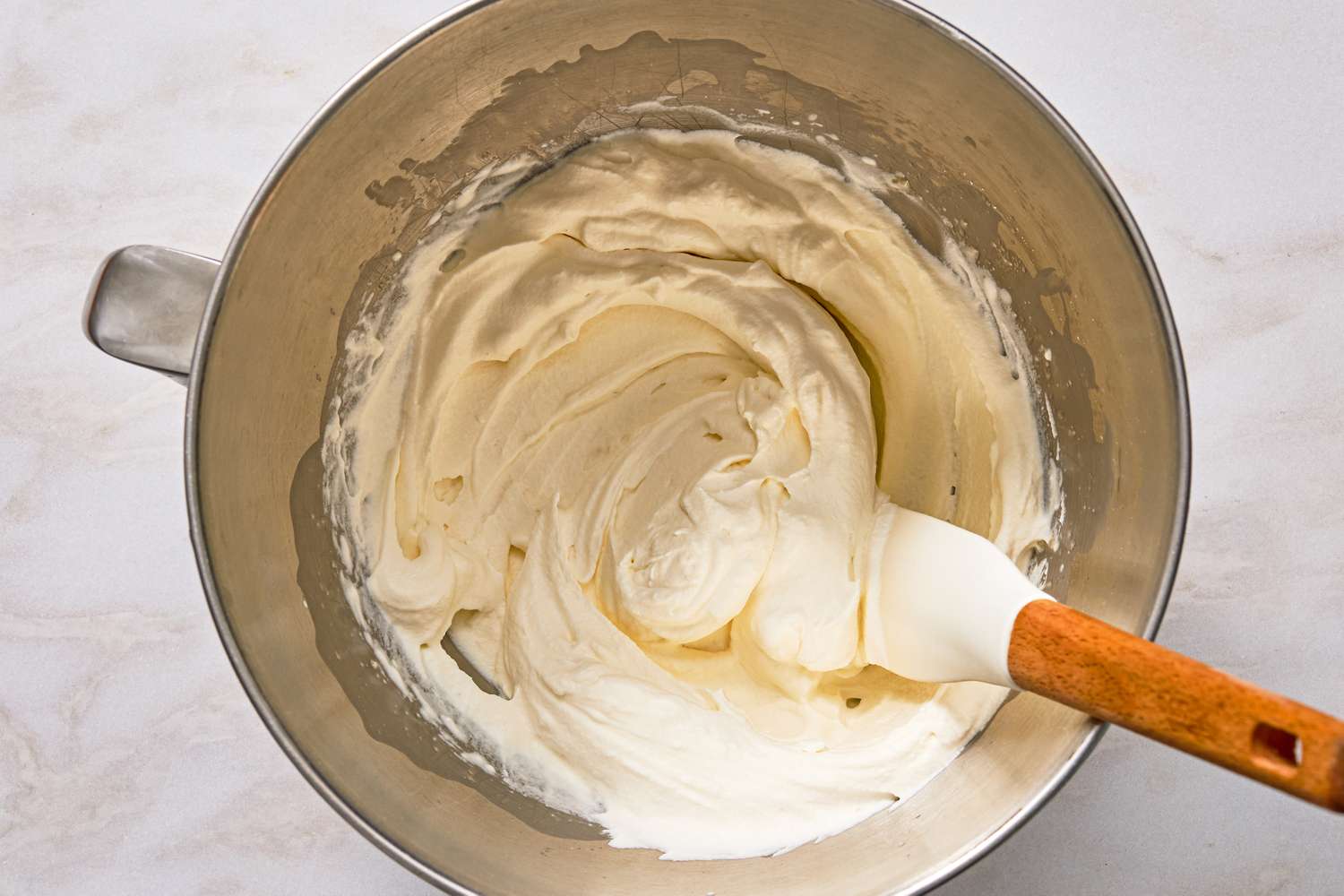 overhead view of whipped cream in a mixing bowl for Chocolate-Peanut Butter Delight