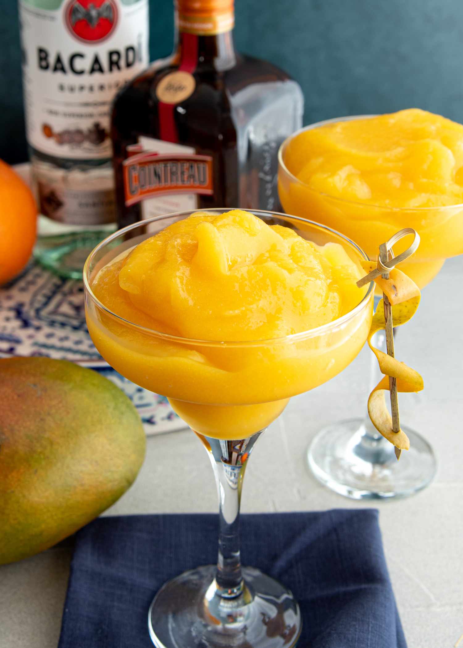 Frozen mango daiquiris in martini glasses.