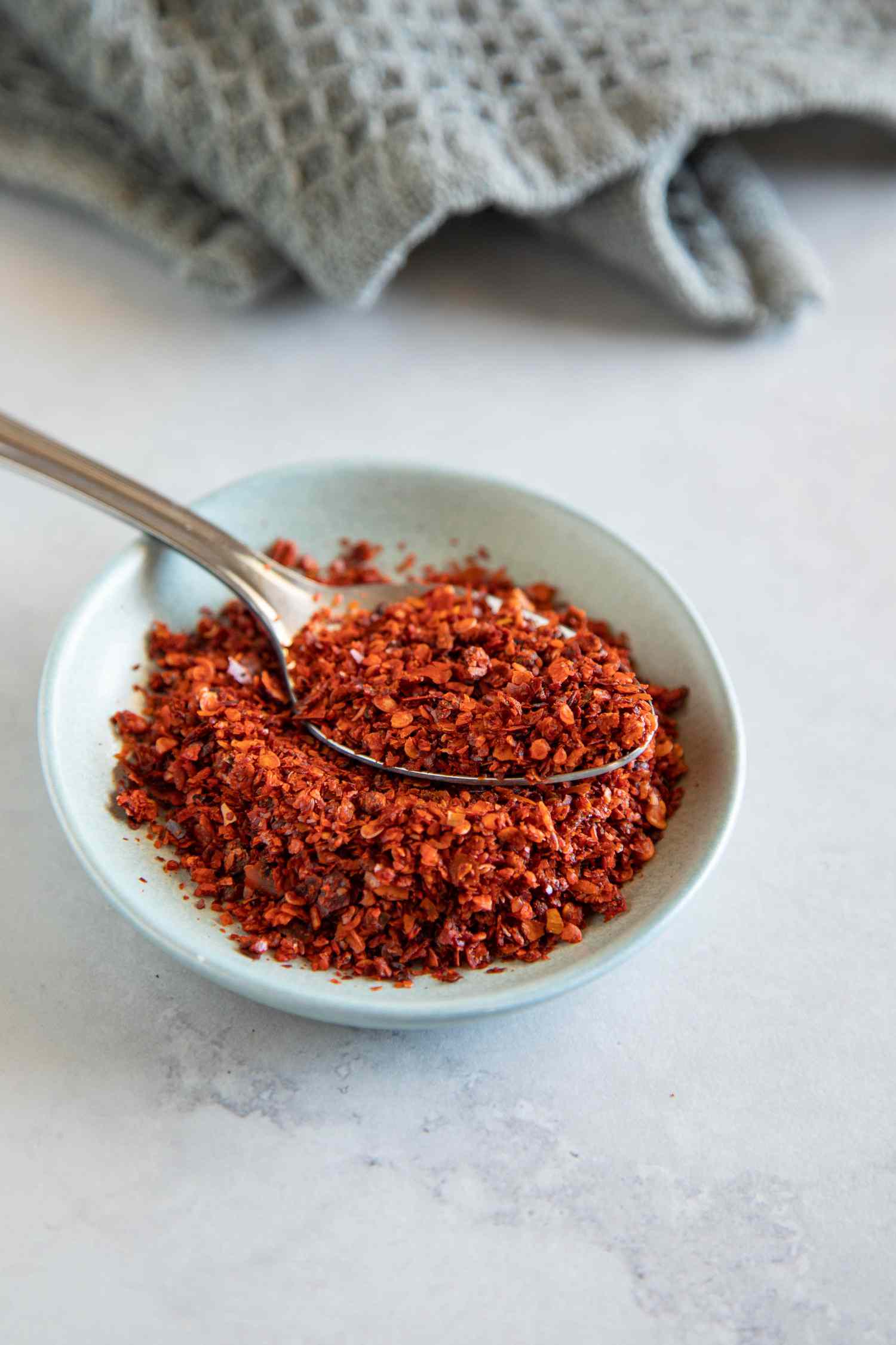 Aleppo pepper in a blue bowl
