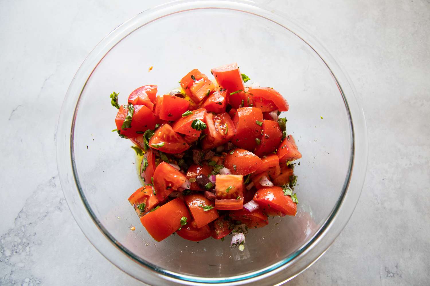 A bowl of chopped tomatoes to make a Mediterranean Greek salad