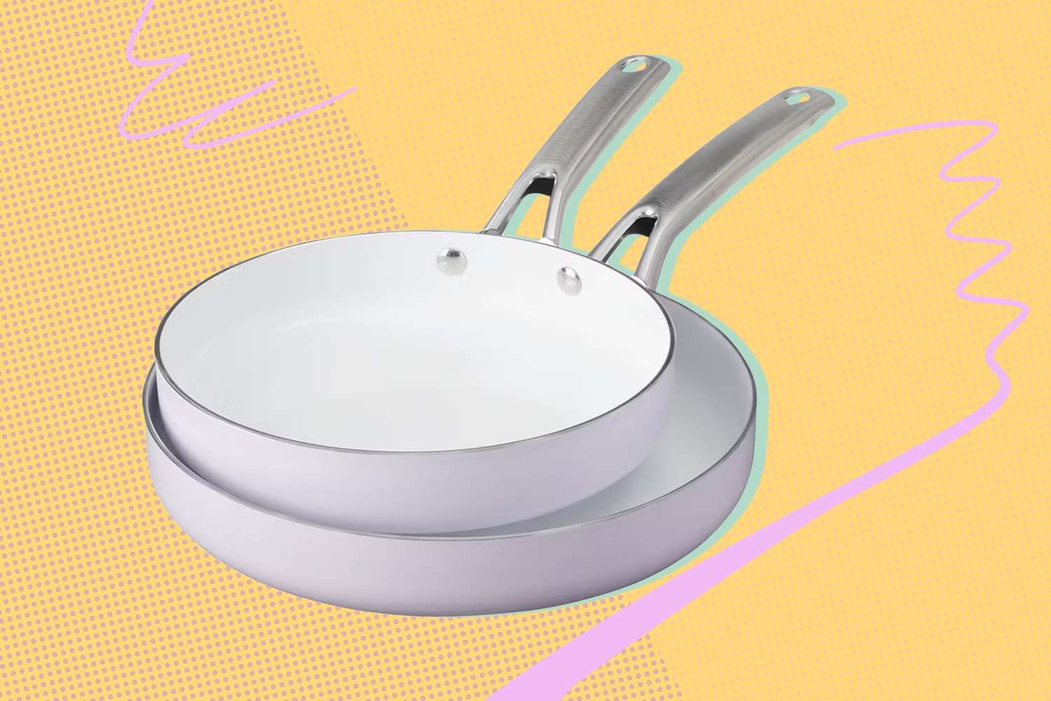 Two white ALDI frying pans stacked on a yellow and pink illustrated background
