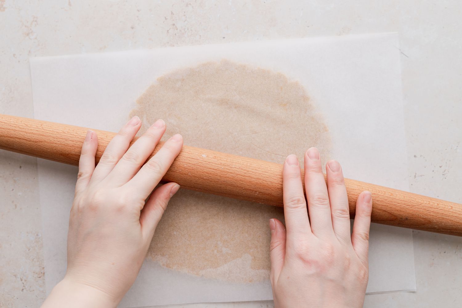 Rolling out dough to make classic linzer cookies.