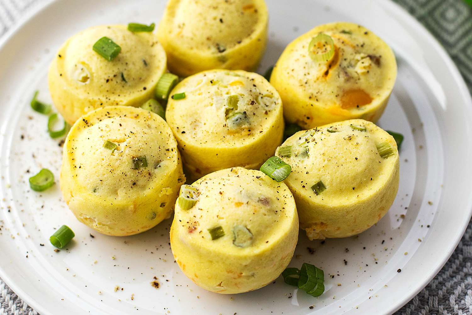 Instant Pot Egg Bites sprinkled with pepper on a plate