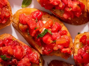 Close-up, overhead photo of bruschetta with tomato and basil